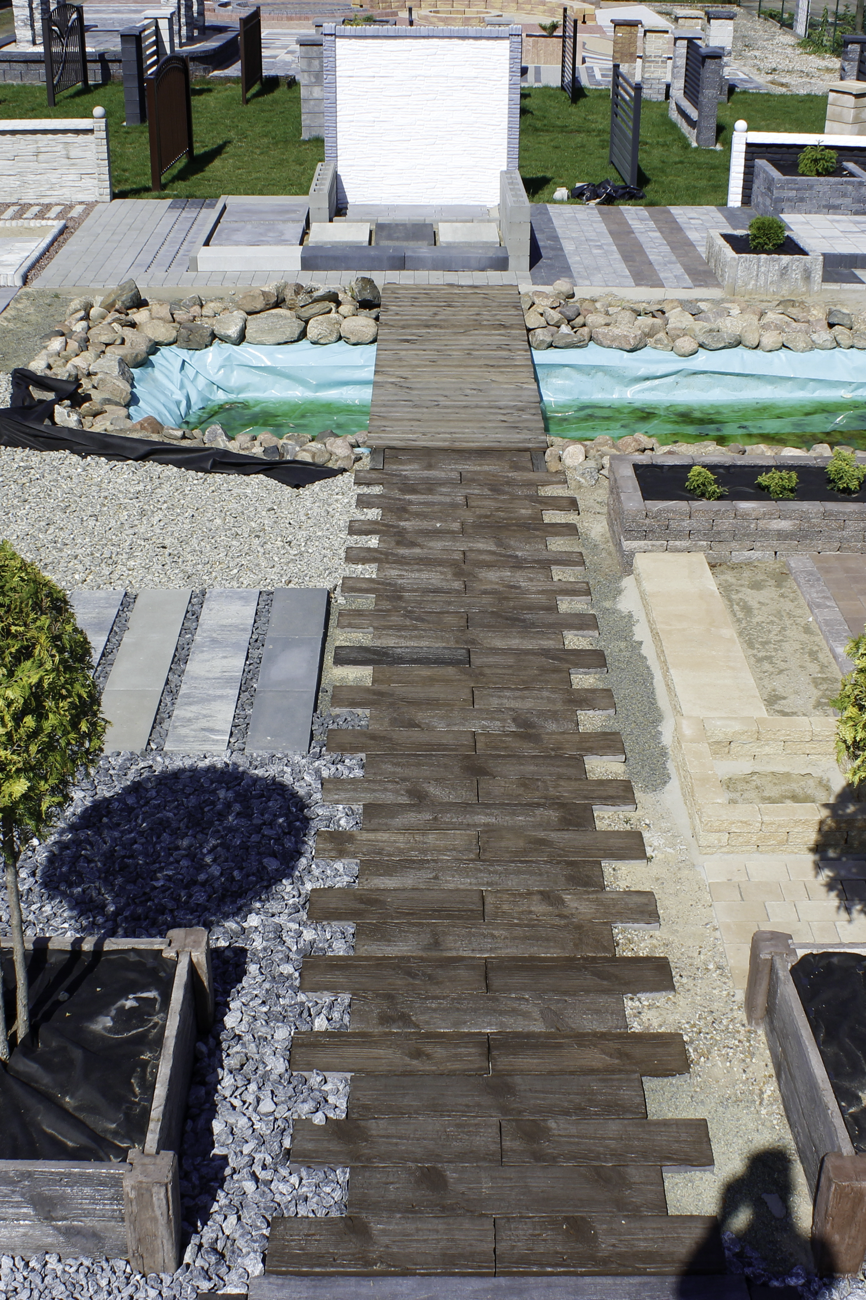 a wooden bridge over a pond