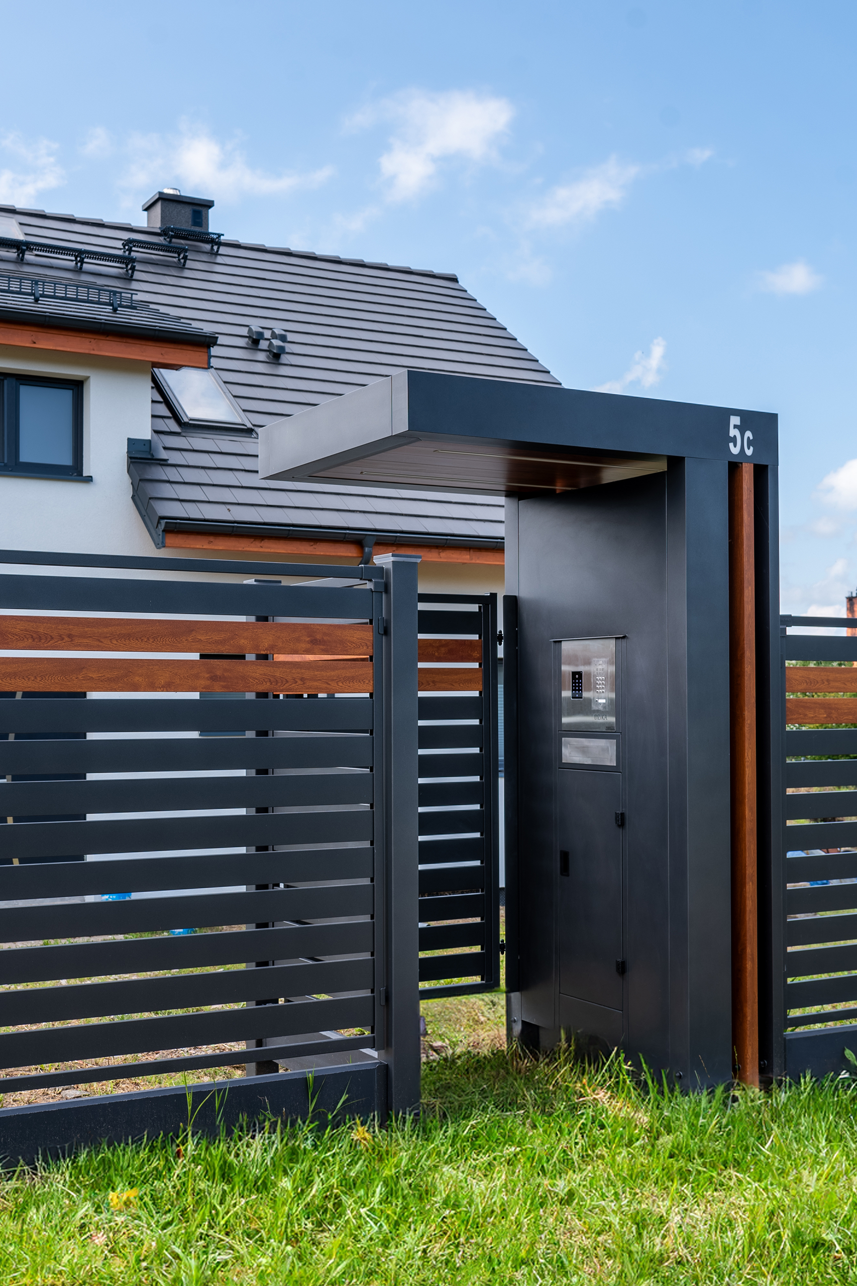 a metal gate with a roof over it